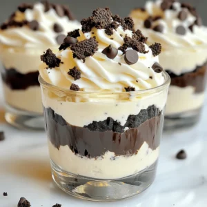 - 16 Oreos, crushed - 1 cup cream cheese, softened - 1/2 cup powdered sugar - 1 teaspoon vanilla extract - 1 cup whipped cream (homemade or store-bought) - 1/2 cup mini chocolate chips (for garnish) - Extra Oreos for crumbling on top - Mixing bowls - Electric mixer (or whisk) - Zip-top bag or food processor - Serving cups To create Oreo dessert cups, you need simple and tasty ingredients. First, gather 16 Oreos. I love using these for a crunchy base. You also need one cup of softened cream cheese. This adds a rich, creamy layer to your dessert. Next, grab half a cup of powdered sugar. This sweetens the mix perfectly. Add one teaspoon of vanilla extract for flavor. It makes everything taste even better! Whipped cream is key too. Use one cup, either homemade or store-bought. It lightens the dessert and makes it fluffy. Don’t forget the mini chocolate chips! You’ll need half a cup for a cute garnish. Lastly, keep some extra Oreos for crumbling on top. This will give your cups a nice finish. For tools, have mixing bowls ready. You will need an electric mixer or a whisk to mix your ingredients. A zip-top bag or food processor is great for crushing the Oreos. Finally, get some nice serving cups to layer your dessert. You can find the full recipe to create these delicious Oreo dessert cups in the next section. - Crushing the Oreos Start by crushing the Oreos. You can use a zip-top bag or a food processor. Aim for fine crumbs. This creates a great base for your dessert cups. Reserve about 2 tablespoons of the crushed Oreos for later. - Mixing the cream cheese and sugar In a large bowl, add the crushed Oreos, softened cream cheese, powdered sugar, and vanilla extract. Mix these together until they are smooth. This mixture should be creamy and well combined. - Layering the Oreo mixture Grab your serving cups. Begin by adding a layer of the Oreo mixture. Fill each cup halfway. This will be the first layer of deliciousness. - Adding whipped cream layers Now, add a layer of whipped cream on top of the Oreo mixture. Spread it out evenly. Repeat the layers until the cups are nearly full. Leave some space at the top for the finishing touches. - Topping with Oreo crumbs and chocolate chips Sprinkle the reserved Oreo crumbs and mini chocolate chips on top of each dessert cup. This adds a nice crunch and looks great. - Chilling time for optimal flavor Place the dessert cups in the refrigerator. Chill them for at least 30 minutes. This helps the flavors blend together. The result is a tasty and refreshing treat. For the full recipe, follow the steps above and enjoy making your Oreo Dessert Cups! To get the best cream cheese mixture, make sure your cream cheese is softened. Cold cream cheese does not mix well. Leave it out for about 30 minutes before you start. This makes blending easier and smoother. When mixing, use a hand mixer or a whisk. Start on low speed to blend the cream cheese with the powdered sugar. Then, increase to medium speed until fluffy. This step is key for a light texture in the dessert cups. Presentation matters! For a fun party look, use clear cups. This way, everyone can see those delicious layers. Top each cup with a small dollop of whipped cream and a half Oreo for a cute touch. You can even add a few mini chocolate chips on top for some extra flair. Try adding fresh berries for color. Strawberries or raspberries work well. They add brightness and a burst of flavor. One big mistake is overmixing the whipped cream. If you mix it too long, it can turn grainy. Mix gently just until it’s blended in. This keeps the fluffiness you want. Another mistake is not chilling long enough. Let the dessert cups chill for at least 30 minutes. This helps the flavors blend and sets the layers. If you skip this step, the cups may not hold their shape when served. {{image_2}} You can change up the Oreo dessert cups in fun ways. Adding peanut butter or Nutella gives a rich twist. Just mix a few spoonfuls into the cream cheese layer. You can also layer in fresh fruit like strawberries or bananas. This adds a bright flavor and color. Try adding a layer of raspberries for a sweet and tart kick. If you need gluten-free options, look for gluten-free Oreos. They taste great and work well in this recipe. For a vegan version, swap cream cheese with a plant-based cream cheese. Use coconut whipped cream instead of regular whipped cream. These swaps keep the dessert tasty while fitting different diets. Switch up how you serve these dessert cups. Mini jars work great for a fun look. They are perfect for parties or picnics. You can also use different types of cookies. Try chocolate cookies or vanilla wafers for a new taste. Each cookie will give your dessert a unique spin. For more ideas, check the Full Recipe. To keep your Oreo dessert cups fresh, store them in the fridge. Use an airtight container. This helps keep the layers from getting soggy. Make sure to cover them well. If you use plastic wrap, place it gently on top. Avoid pressing down on the layers. This way, they stay fluffy and tasty. Oreo dessert cups last about three days in the fridge. After this, they may lose their fresh taste and texture. You can freeze them if you want to keep them longer. However, the texture may change once thawed. If you freeze them, allow them to sit in the fridge overnight before eating. This helps keep the layers intact. You usually don’t need to reheat these dessert cups. They are best served cold. If you want to warm them, do it gently. Use a microwave for just a few seconds. This lets you enjoy the soft cream without ruining the layers. Avoid overheating, or the texture will get mushy. Enjoy your treat! You can make your Oreo Dessert Cups look even tastier with fun toppings. Here are some ideas: - Mini chocolate chips for extra crunch - Crumbled Oreos for a classic touch - Whipped cream dollops for creaminess - Shaved chocolate for a fancy look - Sprinkles for a pop of color These toppings add flavor and texture, making your dessert more exciting. Yes, you can prepare Oreo Dessert Cups in advance. Making them ahead saves time and stress. Here’s how: - Assemble the cups and cover them with plastic wrap. - Store them in the fridge for up to 2 days. This way, the flavors meld together nicely. Just remember to add toppings just before serving for best results. If you want a quick treat, look for pre-made Oreo Dessert Cups in stores. Check these places: - Grocery stores often have them in the dessert aisle. - Some bakeries sell their own versions. - Online retailers like Amazon may offer them too. Always read the labels to ensure they meet your taste needs. For the full recipe, refer to the provided link. In this article, we explored how to make Oreo Dessert Cups with simple steps. We looked at the main ingredients, tools needed, and the step-by-step process. I shared tips to avoid common mistakes and offered fun variations for flavors and dietary needs. Remember, chilling the dessert is key to great taste. Get creative with toppings and enjoy these cups at any event. Now it's time to make your own delicious Oreo Dessert Cups!