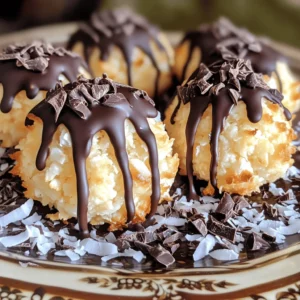 - 3 cups sweetened shredded coconut - 1 cup sweetened condensed milk - 1 teaspoon vanilla extract - 1/4 teaspoon salt - 2 large egg whites - 1/4 cup granulated sugar - 1 cup dark chocolate chips (dairy-free if desired) - 1 tablespoon coconut oil The key to a great coconut macaroon lies in using quality ingredients. The sweetened shredded coconut is the star here. It gives these treats their chewy texture and sweet flavor. Sweetened condensed milk helps bind everything together. It also adds richness. Vanilla extract adds a hint of warmth. A pinch of salt balances the sweetness. Next, the egg whites are crucial. They help create a light and airy texture. Whipping them well is important. It allows the macaroons to rise and stay fluffy. Granulated sugar gives the macaroons a nice sweetness and crunch. Dark chocolate chips add a delicious finish. If you prefer, you can use dairy-free chips. Coconut oil helps the chocolate melt smoothly, making it perfect for dipping. - Almond extract for a nutty touch - Orange zest for a citrus kick - Gluten-free substitutes like almond flour To customize your coconut macaroons, consider adding almond extract. It enhances the flavor and adds a nice twist. Orange zest can brighten the taste, giving it a fresh note. If you want a gluten-free option, almond flour can replace regular flour in other recipes. For the full recipe, check the detailed instructions to create these delightful treats! First, you need to preheat your oven to 325°F (160°C). This step warms the oven evenly. While that heats up, line your baking sheet with parchment paper. This paper stops the macaroons from sticking. It also helps with easy cleanup. Now, grab a large bowl. Add 3 cups of sweetened shredded coconut, 1 cup of sweetened condensed milk, 1 teaspoon of vanilla extract, and 1/4 teaspoon of salt. Mix these well. You want the coconut to soak up the sweet milk. The mixture should be sticky but not too runny. If it's too dry, add a bit more milk. In a separate bowl, take 2 large egg whites and get ready to whip. Use an electric mixer for this. Start on low speed, then increase it. Whip until you see soft peaks form. This means the whites start to hold shape. Slowly add 1/4 cup of granulated sugar while mixing. Keep going until the mixture holds stiff peaks. This is key for fluffy macaroons. Now it's time to form your macaroons. Use a cookie scoop or your hands to make small mounds. Place these on your prepared baking sheet, about 1 inch apart. Bake them in the oven for 20-25 minutes. Look for golden brown edges. This shows they are done. While your macaroons cool, melt 1 cup of dark chocolate chips and 1 tablespoon of coconut oil. Use a microwave-safe bowl. Heat it in 30-second intervals, stirring each time. Once smooth, dip the bottoms of the macaroons into the chocolate. You can also drizzle it on top for a fun look. Let them set on the parchment for about 15 minutes. You can find the full recipe at the beginning of this article. Enjoy your sweet treats! To avoid flat or dense macaroons, make sure your egg whites are whipped well. They should form stiff peaks. This step adds air and lightness. Also, fold the egg whites into the coconut mixture gently. Over-mixing can deflate them. Baking times can vary by oven. Check for doneness around 20 minutes. If your macaroons look golden, they are likely done. Use a toothpick to test the center if unsure. For a lovely look, garnish your macaroons with more coconut or chocolate shavings. A sprinkle of shredded coconut adds charm. You can also drizzle melted chocolate on top for a rich touch. Try serving them on a colorful platter. Arrange them in a circle, or stack them on a cake stand. This makes your treat look extra special. One key pitfall is not whipping the egg whites enough. If they don’t form stiff peaks, your macaroons will be flat. Always check for peak texture before folding. Another mistake is not cooling the macaroons completely before dipping in chocolate. If they are warm, the chocolate may melt too quickly. Allow them to cool on the tray for best results. For the full recipe, make sure to follow all steps closely to avoid any mishaps. {{image_2}} You can change the flavor of your coconut macaroons by adding fun ingredients. Try mixing in nuts like almonds or walnuts for a crunchy texture. Dried fruits such as cranberries or apricots add a sweet chew. Spices can also give a new twist. For example, a pinch of cinnamon or nutmeg brings warmth, perfect for fall. You can even use citrus zest, like lemon or orange, for a fresh burst of flavor. While dark chocolate is a classic choice, you can experiment with white chocolate or flavored chocolates. White chocolate adds a sweet creaminess that pairs well with coconut. If you’re feeling adventurous, try flavored chocolates like mint or orange. For those who follow a vegan diet, you can find dairy-free chocolate options. These chocolates melt just as well and taste amazing. If you need to make the macaroons gluten-free, this recipe is already safe! Just check your chocolate for gluten. To make it dairy-free, use dairy-free chocolate chips and coconut oil. For a sugar-free option, replace the sweetened condensed milk with a sugar-free alternative. You can also use a sugar substitute in the recipe to keep it sweet without the sugar. These adaptations allow everyone to enjoy this delightful treat! You can find the full recipe and all the details to create these yummy treats. To keep your macaroons fresh, store them in an airtight container. This helps retain moisture and flavor. You can layer parchment paper between the macaroons to avoid sticking. Place the container in a cool, dry spot. Avoid direct sunlight, as it can affect taste and texture. At room temperature, the macaroons last about five days. If you want to keep them longer, freezing is a great option. Wrap each macaroon in plastic wrap or foil. Then, place them in a freezer-safe bag or container. They can last for up to three months in the freezer. When you're ready to enjoy them, simply take them out and let them thaw at room temperature. This keeps them soft and tasty. Yes, you can use unsweetened coconut. It will change the taste and sweetness. The macaroons will be less sweet and more nutty. If you prefer a less sugary treat, this option works well. Just keep in mind it may need extra sweetener or flavor to balance. For vegan options, use aquafaba, the liquid from canned chickpeas. It whips up nicely like egg whites. You can also use flaxseed meal or chia seeds mixed with water. These will help bind the ingredients but may change the texture a bit. Look for golden edges and a firm texture. The tops should be lightly browned. When you touch them, they should feel set and not soft. If they are too pale, they may need more baking time. Absolutely! You can mix in nuts, dried fruit, or spices. Try almond extract for a nutty flavor. Orange zest adds a fresh twist. Be creative and adjust to your taste preferences. This blog post shared all you need to make perfect macaroons. You learned about essential ingredients, key steps, and helpful tips. Remember, whipping egg whites well creates a fluffy texture. Feel free to customize your flavors and adapt for dietary needs. Store your treats properly to keep them fresh. With practice, you will master this delightful treat. Enjoy making and sharing your delicious macaroons!