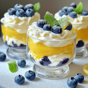 To make Lemon Blueberry Fluff, you need these simple ingredients: - 2 cups fresh blueberries - 1 cup heavy whipping cream - 1/2 cup lemon curd - 1/2 cup powdered sugar - 1 teaspoon vanilla extract - Zest of 1 lemon - Mint leaves for garnish (optional) If you need to convert measurements, here are some simple tips: - 1 cup equals 8 fluid ounces. - 1/2 cup equals 4 fluid ounces. - 1 teaspoon is about 5 milliliters. - 2 cups equal 16 fluid ounces. You can swap some ingredients for your taste: - Use Greek yogurt instead of lemon curd for a tangy twist. - If you want a lighter dessert, try using whipped topping. - For a dairy-free option, use coconut cream instead of heavy cream. - You can replace blueberries with strawberries or raspberries for a new flavor. Using the right ingredients can make Lemon Blueberry Fluff even more delightful. For the full recipe, check out the details above! Start by gathering all your ingredients. This makes cooking smooth and fun. You will need fresh blueberries, heavy whipping cream, lemon curd, powdered sugar, vanilla extract, lemon zest, and mint leaves if you want to garnish. Wash the blueberries gently so they stay whole. In a large bowl, add the heavy whipping cream and the vanilla extract. Use a handheld mixer or a stand mixer. Whip the cream on medium-high speed. Keep an eye on it until soft peaks form. This is the key to a fluffy texture. Gradually add the powdered sugar while mixing. Continue to whip until you see stiff peaks. Be careful here; overwhipping can make it grainy. In another bowl, mix the lemon curd and lemon zest. This brightens the flavor. Gently fold this lemon mixture into your whipped cream. Make sure there are no streaks left. Then, carefully fold in the fresh blueberries, saving some for the top later. Once everything is combined, cover the bowl with plastic wrap. Chill it in the fridge for at least 30 minutes to set. When ready, spoon the Lemon Blueberry Fluff into bowls. Top with the reserved blueberries and a mint leaf if you like. For the complete recipe, check the Full Recipe. To get the best whip, start with cold cream. Cold cream whips better and faster. Use a metal bowl for even better results. Beat the cream until soft peaks form. This takes about three to five minutes. When you add powdered sugar, do it slowly. This helps the sugar mix in well. Keep mixing until stiff peaks form. Be careful! If you mix too long, the cream will turn to butter. Garnishes make your dessert pop. You can add fresh mint leaves for color. A sprinkle of lemon zest adds a nice touch too. If you want more blueberries, use them on top. You can also drizzle honey for extra sweetness. For a fun twist, add crushed graham crackers for crunch. Serve Lemon Blueberry Fluff in clear glasses to show off the layers. This dessert looks great at any gathering. You can make mini servings for parties. It’s perfect for summer barbecues or family dinners. For a fancy touch, pair it with a scoop of lemon sorbet. This dessert is light and refreshing, so it fits well after any meal. You can find the full recipe above to guide you as you prepare this treat! {{image_2}} You can switch out blueberries for other fruits. Strawberries or raspberries work great. They add a fresh taste and bright color. You can also try peaches or mangoes for a tropical twist. Each fruit brings its own flavor and fun to the dish. Just make sure the fruit is fresh and ripe for the best taste. To make a vegan version, use coconut cream instead of heavy cream. Chill the coconut cream overnight for best results. Replace the lemon curd with a vegan lemon pudding. You can find this at most grocery stores or make your own. This way, you can enjoy Lemon Blueberry Fluff without any animal products. You can create a stunning layered dessert with Lemon Blueberry Fluff. Start with a layer of fluff in a glass. Then add a layer of your favorite granola or crushed cookies. Repeat the layers until you reach the top. This not only looks great but adds texture and crunch. Drizzle some extra lemon curd on top for a sweet finish. For the full recipe, check out the guide above. To keep your Lemon Blueberry Fluff fresh, store it in the fridge. Use an airtight container to prevent it from absorbing other smells. Avoid leaving it uncovered. This dessert tastes best when chilled, so make sure to keep it cold until you're ready to serve. You can freeze Lemon Blueberry Fluff, but it may change in texture. To freeze, spoon it into a freezer-safe container. Leave some space at the top for expansion. For best results, eat it within one month. When you're ready, thaw it overnight in the fridge. Stir it gently before serving to restore some creaminess. Lemon Blueberry Fluff lasts about three days in the fridge. After that, the texture may not be as light and fluffy. If you notice any changes in smell or color, it's best to toss it. Always trust your senses when checking for freshness. For the best taste, enjoy it fresh! Yes, you can make Lemon Blueberry Fluff ahead of time. It keeps well in the fridge. Prepare it a few hours or even a day before serving. Just cover it tightly with plastic wrap. Chilling helps the flavors blend. This dessert stays light and fluffy, making it a great make-ahead option. If you don't have lemon curd, you can use yogurt. Greek yogurt adds creaminess and tang. You may also try lemon juice mixed with sugar. This gives you a similar taste but with a different texture. Other citrus curds, like lime or orange, also work well. Experiment to find your favorite! To reduce the sweetness, cut down on powdered sugar. You can start with a quarter cup instead of half. Another option is to use unsweetened whipped cream. This balances the flavor without losing the fluffiness. You can also add more lemon zest. This brings a bright taste that complements the blueberries. For the full recipe, check the section above. In this blog post, we explored Lemon Blueberry Fluff. We covered ingredients, measurement conversions, and substitutions. I shared step-by-step instructions for preparation and whipping. Tips on achieving the perfect whip and garnishing ideas were included. We looked at variations like vegan options and layered desserts. Finally, I shared storage best practices and answered common FAQs. Enjoy making this easy and tasty treat. With a few simple steps, you can create a delightful dessert that everyone will love.
