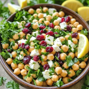 - 1 can (15 oz) chickpeas, drained and rinsed - 1 cup crumbled feta cheese - 1/2 cup dried cranberries - 1/4 cup red onion, finely chopped - 1/4 cup fresh parsley, chopped - 1/4 cup olive oil - 2 tablespoons fresh lemon juice - 1 teaspoon lemon zest - 1 teaspoon honey (or maple syrup for a vegan option) - Salt and pepper to taste Chickpeas are the star of this recipe. They are packed with protein and fiber. Feta adds a creamy texture and tangy flavor. Dried cranberries bring sweetness and a pop of color. This mix is not just tasty; it also offers many health benefits. In each serving, you will find about 300 calories. This dish includes around 12 grams of protein, 15 grams of fat, and 30 grams of carbohydrates. You also get 6 grams of fiber. Chickpeas are great for heart health. They can help you feel full longer. Feta cheese provides calcium, good for your bones. Dried cranberries are rich in antioxidants, which support your immune system. For more details on how to make this dish, check the Full Recipe. First, you need to prepare the main ingredients. Gather your chickpeas, red onion, feta cheese, dried cranberries, and fresh parsley. In a large mixing bowl, combine: - 1 can (15 oz) chickpeas, drained and rinsed - 1/4 cup red onion, finely chopped - 1 cup crumbled feta cheese - 1/2 cup dried cranberries - 1/4 cup fresh parsley, chopped Next, let’s make the zesty lemon vinaigrette. In a separate bowl, whisk together: - 1/4 cup olive oil - 2 tablespoons fresh lemon juice - 1 teaspoon lemon zest - 1 teaspoon honey (or maple syrup for a vegan option) - Salt and pepper to taste This vinaigrette will give the salad a bright and fresh flavor. Now, pour the vinaigrette over the chickpea mixture. Gently toss everything together. Make sure all the ingredients get a nice coating of the vinaigrette. This step is key for flavor. Let the salad sit for at least 10 minutes. This allows the flavors to meld. You can serve it chilled or at room temperature. Enjoy your Feta & Cranberry Chickpeas with Zesty Lemon Vinaigrette! For the complete recipe, check out the Full Recipe section. Adjust the salt and pepper to your taste. Start with a pinch of salt and a few twists of pepper. Mix well and taste. You can always add more. This salad gets better as it sits. Letting the flavors meld for at least 10 minutes makes a big difference. The chickpeas soak up the vinaigrette, making each bite burst with flavor. When serving, use a large bowl or a platter. This makes it look inviting. Garnish with extra parsley and a sprinkle of feta. Add lemon wedges on the side for a fresh touch. This salad pairs well with grilled chicken or warm pita bread. Both options add protein and a nice texture. You can prep this salad in advance. It keeps well in the fridge for a few days. Store it in an airtight container to maintain freshness. If you are making it ahead, wait to add the vinaigrette until just before serving. This keeps the chickpeas and feta from getting soggy. For the best taste, try to eat it within three days. For the full recipe, check the earlier section. {{image_2}} You can easily adjust this dish to fit your needs. For a vegan version, swap the feta cheese for tofu or a vegan cheese. This keeps the flavor and texture while making it plant-based. If you don’t have chickpeas, white beans or lentils work well too. They add protein while keeping the dish hearty. This salad is a great base for adding more ingredients. Try adding chopped bell peppers or cucumbers for extra crunch. Nuts like walnuts or almonds can add healthy fats and texture. You can also switch up the dried cranberries with raisins or cherries. For seasonal variations, add roasted pumpkin in the fall or fresh peas in the spring. Each change gives a new twist to the dish. While the zesty lemon vinaigrette is a hit, other dressings can work too. A balsamic vinaigrette adds sweetness and depth. You can also try a creamy dressing, like a yogurt-based ranch, for a different taste. Just mix yogurt with lemon juice and herbs for a simple creamy option. Each dressing can change the flavor profile, making this dish fun and versatile. For the full recipe, check [Full Recipe]. To keep your Feta & Cranberry Chickpeas fresh, store leftovers in an airtight container. This helps prevent air from spoiling the flavors. A glass container works best, as it does not retain odors. You can keep it in the fridge for up to three days. Make sure the salad is cool before sealing. Can this salad be frozen? I don't recommend freezing the entire salad. The texture of feta and chickpeas can change when frozen. Instead, you can freeze chickpeas and feta separately. Place them in freezer-safe bags or containers. This way, you can enjoy them later without losing quality. If you need to reheat, do it gently. The best way is to warm it in a pan over low heat. Stir often to avoid burning. However, this salad tastes best cold. Serving it chilled keeps the flavors bright and fresh. Enjoy it straight from the fridge for a refreshing treat! Can I make this salad in advance? Yes, you can make this salad ahead of time. Just store it in the fridge. The flavors improve as it sits. What can I serve it with? This salad pairs well with grilled chicken or fish. You can also serve it with pita bread or over greens. How long does it last in the fridge? The salad stays good for about three days. Keep it in an airtight container. Can I use canned chickpeas? Absolutely! Canned chickpeas are perfect for this recipe. Just drain and rinse them before using. What’s the best type of feta to use? I recommend using block feta cheese. It has a creamier texture and better flavor than crumbled feta. Can I use fresh cranberries instead of dried? Fresh cranberries are too tart for this salad. Stick with dried cranberries for the best taste. What makes the vinaigrette zesty? The zing comes from fresh lemon juice and lemon zest. They brighten up the whole salad. Can I customize the dressing? Yes! Feel free to add herbs or spices. A pinch of garlic powder or fresh herbs can add a nice touch. This salad combines chickpeas, feta, and cranberries into a tasty dish. You learned about ingredients, preparation, and serving tips. You can adjust flavors and try different variations. Storing leftovers is easy with simple tips. Incorporate this recipe into your meals for great nutrition and flavor. Enjoy making it your own!
