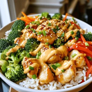 - Chicken and Vegetables - 2 boneless, skinless chicken breasts - 1 cup cooked jasmine rice - 1 cup broccoli florets - 1 carrot, julienned - 1 red bell pepper, sliced - 2 green onions, chopped - Sauce Components - 1 tablespoon cornstarch - 2 tablespoons vegetable oil - 1/4 cup mayonnaise - 2 tablespoons sweet chili sauce - 1 tablespoon sriracha (adjust for spice) - Salt and pepper to taste - Optional Toppings - Sesame seeds for garnish Gather these ingredients to create a tasty Bang Bang Chicken Bowl. Fresh veggies and juicy chicken bring flavor and color. The sauce adds a sweet and spicy kick that makes this dish shine. You can find the Full Recipe above for more details on making this delightful meal. First, cut the chicken breasts into bite-sized pieces. Use a sharp knife for clean cuts. Next, season the chicken with salt and pepper. This adds base flavor. Then, sprinkle cornstarch over the chicken. Toss it well to coat every piece. The cornstarch gives a nice crunch when cooked. Heat the vegetable oil in a large skillet over medium heat. Wait for the oil to shimmer before adding the chicken. This step ensures a good sear. Cook the chicken pieces for about 6-8 minutes. Stir occasionally to avoid burning. You want them golden brown and fully cooked. Check that the inside is no longer pink. In the same skillet, add more oil if needed. Toss in the broccoli, carrot, and red bell pepper. Sauté them for about 3-4 minutes. The goal is tender-crisp texture. You want them bright and vibrant. Remove from heat and set aside. In a small bowl, mix the mayonnaise, sweet chili sauce, and sriracha. Use a whisk or fork to blend well. Taste the sauce and adjust the spice level. If you like it spicier, add more sriracha. For a milder flavor, reduce the amount. Start by layering the cooked jasmine rice in serving bowls. It acts as the base. Next, add the sautéed vegetables on top. Then, place the cooked chicken pieces. Finally, drizzle the Bang Bang sauce over everything. This step ties all the flavors together. Sprinkle chopped green onions and sesame seeds on top. These add flavor and a nice crunch. For presentation, serve in colorful bowls. This makes your meal more inviting. Enjoy your Bang Bang Chicken Bowl! For the complete recipe, refer to the Full Recipe. To keep your chicken juicy, start with boneless, skinless chicken breasts. Cut them into small pieces, then season with salt, pepper, and cornstarch. The cornstarch helps lock in moisture. When cooking, heat your oil over medium heat. Add the chicken to the hot oil. Cook until it turns golden brown, about 6-8 minutes. This ensures a tasty crust while keeping the inside tender. For perfect sautéed vegetables, use fresh broccoli, carrots, and red bell peppers. After cooking the chicken, add a bit more oil if needed. Sauté the veggies for 3-4 minutes. This helps them stay crisp and bright. Remove them from heat as soon as they are tender. You can adjust the spice and sweetness of your Bang Bang sauce. Start with the base of mayonnaise and sweet chili sauce. Add sriracha slowly to find your preferred heat level. For extra flavor, try mixing in a dash of lime juice or garlic powder. These additions can elevate the taste and make it more exciting. Pair your Bang Bang Chicken Bowl with side dishes like a simple salad or steamed edamame. These sides can balance the meal and add freshness. Serve the bowl warm for the best taste. The rice and chicken should be hot, while the veggies are still crisp. Enjoy your meal right after assembling for maximum flavor. {{image_2}} You can easily switch the chicken for shrimp or tofu. Shrimp cooks fast and adds a nice flavor. Just sauté it until it turns pink. Tofu offers a great plant-based option. Use firm tofu, press it to remove water, and cut it into cubes. This way, it absorbs all the flavors well. You can also swap out chicken for beef or pork. Just adjust cooking times to keep the meat juicy. Jasmine rice is great, but you can try other types too. Brown rice adds fiber and a nutty taste. Quinoa is another healthy choice, full of protein. If you want a low-carb option, use cauliflower rice. It cooks quickly and still gives a nice texture. Just sauté it for a few minutes until tender. Feel free to mix up the veggies in your bowl. Snow peas, bell peppers, or snap peas work well. You can also use frozen vegetables for convenience. Seasonal veggies are great too. In summer, try zucchini or asparagus. In fall, butternut squash or Brussels sprouts are delicious. Each option adds a unique twist to your Bang Bang Chicken Bowl. For the complete recipe, check out the [Full Recipe]. Store your Bang Bang Chicken Bowl in the fridge. It stays fresh for about 3 days. Keep it in an airtight container to lock in flavor. This helps prevent any moisture loss. If you notice any odd smells, it’s best to toss it out. Yes, you can freeze this dish. Just place it in a freezer-safe container. Make sure to separate the sauce from the chicken and veggies. This helps keep the texture nice. To thaw, leave it in the fridge overnight. Reheat it gently to keep it juicy. For the best taste, use the stove or microwave. If using a stove, warm it slowly over low heat. Add a splash of water to help steam it. In the microwave, heat in short bursts, stirring in between. This keeps it from overcooking. Enjoy your meal just as delicious as the first time! To make the Bang Bang Chicken Bowl gluten-free, you can swap a few ingredients. Use gluten-free soy sauce instead of regular soy sauce if you choose to add it. For the sauce, make sure the sweet chili sauce is gluten-free. Also, check the mayonnaise for gluten-free labeling. Cornstarch is naturally gluten-free, so you can keep that in your recipe. These swaps ensure you enjoy the same great taste without gluten. You can serve many sides with the Bang Bang Chicken Bowl. Try a simple cucumber salad for a fresh crunch. Steamed edamame is another great choice, adding protein and fiber. If you want something warm, serve miso soup. For drinks, pair it with iced green tea or a light lemonade to balance the flavors. These options will enhance your meal and make it even more enjoyable. Yes, you can meal prep the Bang Bang Chicken Bowl. Cook the chicken and vegetables in advance. Store them in separate containers in the fridge. You can also prepare the sauce ahead of time. Keep everything fresh by storing the sauce separately. When you're ready to eat, just reheat the chicken and veggies. Assemble your bowl with rice and sauce, and you have a quick, tasty meal ready to go. This blog post shared how to create a Bang Bang Chicken Bowl from scratch. We covered ingredients, preparation steps, and cooking tips. You learned how to ensure juicy chicken and crisp veggies, along with sauce customization. Remember, you can switch proteins, rice, and veggies for variety. Store leftovers properly, and enjoy this meal any time. With these tips, you can make a tasty dish that satisfies your cravings.