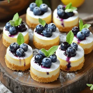 - 1 cup graham cracker crumbs - 1/4 cup unsalted butter, melted - 16 oz cream cheese, softened - 1/2 cup granulated sugar - 1/4 cup sour cream - 1 tablespoon lemon zest - 2 tablespoons fresh lemon juice - 1 teaspoon vanilla extract - 2 large eggs - 1 cup fresh blueberries - Additional blueberries for topping These main ingredients create a rich, creamy base that shines with lemon and blueberry flavors. The graham cracker crumbs form a crunchy crust that balances the smooth cheesecake. Cream cheese gives this dessert its creamy texture. The sour cream adds softness, while the lemon zest and juice brighten the taste. Fresh blueberries bring natural sweetness and a pop of color. - 1 tablespoon cornstarch (for blueberry topping) - 1 tablespoon sugar (for blueberry topping) Using cornstarch thickens the blueberry topping, making it syrupy and delicious. The extra sugar enhances the blueberries’ natural sweetness. You can add these optional ingredients if you want to elevate your mini cheesecakes even more. If you want to explore more about how to make these delightful mini cheesecakes, check the Full Recipe for detailed steps. - Preheat the oven and prepare the muffin pan: Start by setting your oven to 325°F (160°C). This temperature is perfect for baking mini cheesecakes. Line a muffin pan with cupcake liners or grease it with non-stick spray. This step helps with easy removal later. - Combine graham cracker crumbs and melted butter: In a mixing bowl, take 1 cup of graham cracker crumbs and add 1/4 cup of melted unsalted butter. Stir well until the crumbs soak up the butter. This mixture forms a tasty base for your cheesecake. - Beat cream cheese and sugar until smooth: In a large bowl, use an electric mixer to beat 16 oz of softened cream cheese with 1/2 cup of granulated sugar. Mix until the mixture is smooth and creamy. This is key for a rich cheesecake. - Mix in sour cream, lemon zest, lemon juice, and vanilla extract: Next, add 1/4 cup of sour cream, 1 tablespoon of lemon zest, 2 tablespoons of fresh lemon juice, and 1 teaspoon of vanilla extract. Blend these ingredients until well mixed. The lemon adds a bright flavor that complements the blueberries. - Incorporate eggs into the mixture and fold in blueberries: Add 2 large eggs, one at a time. Mix well but avoid overmixing, as this can make the cheesecake dense. Gently fold in 1 cup of fresh blueberries. This step brings a burst of fruity flavor to each bite. - Bake mini cheesecakes and cool properly: Pour the cheesecake filling into each muffin liner, filling them about 3/4 full. Bake for 18-20 minutes. The centers should be set but still slightly jiggly. Turn off the oven and let them sit inside for an extra 10-15 minutes. This helps them cool gently. Afterward, let them cool at room temperature before chilling in the fridge for at least 2 hours. This process ensures your mini lemon blueberry cheesecakes come out perfectly creamy and delicious. For more detailed steps, check the Full Recipe. To create the perfect mini lemon blueberry cheesecake, avoid overmixing the batter. Overmixing can lead to a dense texture instead of the creamy delight we want. Mix just until the ingredients combine, and you’ll keep that luscious mouthfeel. Cooling is key for flavor. After baking, turn off the oven and let the cheesecakes cool inside for 10-15 minutes. This gentle cooling helps prevent cracks and keeps the texture smooth. Then, move them to the fridge to chill for at least 2 hours. Chilling helps the flavors deepen and blend nicely. Serving ideas add a touch of elegance. Place your mini cheesecakes on a lovely platter. You can sprinkle powdered sugar on top for a sweet touch. Fresh mint leaves add a pop of color and a hint of freshness. For garnishing, consider adding more blueberries on top. These add not only color but also a burst of flavor. You might even drizzle some blueberry syrup if you made it. This will enhance the visual appeal and make your dessert look like it came from a fancy restaurant. For the full recipe, you can check the section above. {{image_2}} You can easily change the flavor of these mini lemon blueberry cheesecakes. Try using different fruits like strawberries or raspberries. Each fruit brings a new taste. You can also add flavored creams or extracts. A hint of almond or coconut can add depth. For those needing gluten-free options, swap the graham cracker crust with gluten-free crumbs. This keeps the base tasty while fitting your needs. If you want a healthier treat, use sugar alternatives like honey or agave syrup. These swaps can make your mini cheesecakes even better for you. Explore these variations to find your favorite twist on the mini lemon blueberry cheesecakes. For a full recipe, refer to the [Full Recipe]. To store mini cheesecakes in the fridge, follow these steps: - Allow the cheesecakes to cool completely. - Place them in an airtight container. - Store them in the fridge for safe keeping. If you want to freeze mini cheesecakes for later, here’s what to do: - Wrap each cheesecake tightly in plastic wrap. - Place them in a freezer-safe bag or container. - These can be frozen for up to three months. Mini cheesecakes last about five days in the refrigerator. This keeps them fresh and tasty. To maintain freshness, follow these best practices: - Keep them in an airtight container. - Avoid leaving them out at room temperature for too long. - Always check for any signs of spoilage before serving. For the full recipe of these delightful treats, check the [Full Recipe]. How long do I bake mini cheesecakes? You bake mini cheesecakes for 18 to 20 minutes. They should be set but slightly jiggly in the center. This ensures a creamy texture. Overbaking can lead to dryness, so keep an eye on them. Can I use frozen blueberries instead of fresh? Yes, you can use frozen blueberries. They may release more juice, so adjust the sugar in the topping. This can add a pleasant twist to your cheesecakes. Just remember to thaw and drain them before mixing. How can I adjust for fewer servings? To adjust for fewer servings, halve the ingredients. Use a smaller muffin pan if you have one. You can also bake the remaining batter in a small dish for a mini cheesecake. This way, you still enjoy the recipe without waste. What can I substitute for sour cream? You can use Greek yogurt as a substitute for sour cream. It provides a similar tang and creaminess. You can also try cream cheese mixed with a bit of lemon juice for an extra flavor boost. This blog post walks you through making delicious mini cheesecakes with blueberries. You learned about the key ingredients, easy steps for preparation, and baking methods. I also shared useful tips to help you perfect your cheesecakes. Variations and storage options give you flexibility in your recipe. With these insights, you can whip up impressive treats. Baking at home is fun and tasty. Enjoy making your mini cheesecakes and sharing them with others!
