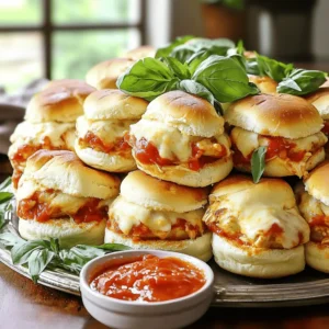 - 1 lb ground chicken - 1/2 cup breadcrumbs - 1/4 cup grated Parmesan cheese - 1 tablespoon Italian seasoning To make tasty chicken Parmesan sliders, you need simple ingredients. Ground chicken is the base. It keeps the sliders juicy and tender. Breadcrumbs help bind the patties, giving them a nice texture. Parmesan cheese adds a salty, savory flavor. Italian seasoning brings a burst of herbs to each bite. - 1 teaspoon garlic powder - 1 cup marinara sauce - 1 1/2 cups shredded mozzarella cheese - Fresh basil leaves For extra flavor, we add garlic powder. It gives a nice kick without being too strong. Marinara sauce is a must. It adds moisture and a rich taste. Shredded mozzarella cheese melts beautifully and creates a gooey layer on top. Fresh basil leaves not only look pretty but also add a fresh touch. - 12 slider buns - Olive oil spray The slider buns are the final component. They hold everything together and add a soft bite. Olive oil spray helps prevent sticking when baking. It also helps the tops of the sliders get a lovely golden color. For the full recipe, follow along and enjoy making these sliders! 1. Preheating the oven: Start by preheating your oven to 375°F (190°C). This step is crucial for even baking. While the oven heats, lightly grease a baking tray with olive oil spray. 2. Mixing the chicken mixture: In a large bowl, combine the ground chicken, breadcrumbs, grated Parmesan cheese, Italian seasoning, garlic powder, salt, and black pepper. Mix well until everything blends together smoothly. This mixture forms the base of your sliders. 1. Pan-frying instructions: Heat a non-stick skillet over medium heat. Add a drizzle of olive oil to the pan. Shape the chicken mixture into small patties, about the size of your palm. Cook the patties for about 5 minutes on each side. Look for a golden brown color. 2. Checking internal temperatures: Use a meat thermometer to check the internal temperature. It should reach 165°F (75°C) to ensure the chicken is safe to eat. 1. Layering marinara and cheese: Once the patties are cooked, place them on the bottom halves of the slider buns. Spoon warm marinara sauce over each patty. Top each with shredded mozzarella cheese. 2. Baking times and tips: Cover the tray with aluminum foil and place it in the preheated oven. Bake for 10-12 minutes, or until the cheese is melted and bubbly. For a crispy top, remove the foil and bake for an additional 5 minutes. Enjoy your sliders with fresh basil leaves on top for a delightful finish. To make tasty chicken sliders, focus on texture and flavor. Ground chicken needs some help to be juicy. Mix in breadcrumbs, Parmesan, and Italian seasoning for great taste. These ingredients keep the chicken moist and full of flavor. Cook the patties until they are golden brown. This will give you a nice crunch on the outside. For cooking methods, pan-frying is best for a crispy surface. You can also bake them for a healthier option. Just make sure to watch the time so they don’t dry out. If you bake them, cover with foil at first to keep the moisture in. When it’s time to serve your sliders, make them look great! Stack them high on a big platter for a fun display. You can also add a small bowl of warm marinara on the side. This gives your guests a chance to dip their sliders. It’s a fun and interactive way to enjoy them. For side dishes, think about fresh salads or baked fries. A light salad pairs well with the rich flavors of the sliders. You could even offer some potato chips for a crunchy option. Get creative with your sliders! You can add veggies like spinach or roasted peppers. Different cheeses like provolone or gouda can also change the flavor. If you want to make them gluten-free, use gluten-free breadcrumbs. For low-carb options, you can skip the buns. Instead, serve the patties on lettuce leaves. This keeps the flavor but cuts down on carbs. The Full Recipe has many ways to make these sliders your own! {{image_2}} You can switch the ground chicken for turkey or beef in this recipe. Turkey gives a lighter taste and is a great choice. Beef adds a richer flavor and goes well with the marinara. If you want a veggie option, try using black beans or chickpeas. Mash them and add breadcrumbs for texture. This makes a hearty slider that everyone can enjoy. To kick up the heat, add some hot sauce to the chicken mix. A few drops can give your sliders a spicy twist. You can also play with Italian herbs, like oregano or thyme. These spices can enhance the slider's taste. Try adding a sprinkle of crushed red pepper for extra flavor. If you want to make low-fat sliders, use lean ground chicken or turkey. This keeps the taste without the extra calories. For a dairy-free option, swap the mozzarella with a plant-based cheese. Many brands offer great flavors that melt well. You can enjoy delicious sliders while meeting your dietary needs. For the full recipe, check out the [Full Recipe]. To keep your leftover sliders fresh, store them in the fridge. Use an airtight container to avoid drying out. They can last in the fridge for about three days. If you want to save them longer, freezing is a good option. Wrap the sliders tightly in plastic wrap and then place them in a freezer bag. This way, they can stay fresh for up to three months. When it comes to reheating, you want to keep the sliders moist. The best method is to use an oven. Preheat it to 350°F (175°C) and place the sliders on a baking sheet. Cover them with foil to keep them from drying out. Heat for about 10-15 minutes. If you prefer, a microwave works too. Just heat them for about 30 seconds, but this might make them a bit soggy. How long can sliders last? In the fridge, they last about three days. In the freezer, they can last three months. Always check for signs of spoilage. If you see mold or smell something off, it’s best to throw them away. Always trust your nose and eyes! Enjoy your tasty Chicken Parmesan Sliders by keeping them fresh and safe. For the Full Recipe, refer back to the earlier section! Chicken Parmesan sliders are mini sandwiches filled with tasty chicken patties. I make these patties with ground chicken, breadcrumbs, and Parmesan cheese. I add Italian seasoning and spices for flavor. Then, I cook them until golden brown. I top each slider with marinara sauce and melted mozzarella cheese. These sliders are perfect for parties or game day. Yes, you can prepare Chicken Parmesan sliders ahead of time. Make the chicken patties and store them in the fridge. You can also mix the sauce and cheese in advance. When you're ready, just assemble and bake them. This saves time when you have guests or a busy week ahead. To add heat to your sliders, mix some crushed red pepper flakes into the chicken mixture. You can also add hot sauce to the marinara sauce. For a flavorful twist, try using pepper jack cheese instead of mozzarella. These tips will give your sliders a nice kick. Chicken Parmesan sliders pair well with many sides. Try serving them with a fresh salad or crispy fries. You can also add some roasted veggies for a colorful plate. For drinks, consider iced tea or a light Italian soda. These pairings make for a fun meal. To keep your chicken sliders juicy, do not overcook the patties. Aim for an internal temperature of 165°F (75°C). Adding breadcrumbs helps retain moisture. You can also use a bit of olive oil when cooking. This keeps the patties tender and flavorful. In this post, we explored how to craft delicious Chicken Parmesan Sliders. We covered essential ingredients, cooking methods, and tasty variations. You learned the steps to prepare, assemble, and serve these sliders. Plus, I shared tips for storing leftovers and keeping them fresh. These sliders are not just a meal; they are fun to eat. Experiment with flavors and ingredients to make them your own. Try different meats or spice levels, and enjoy every bite. Happy cooking!