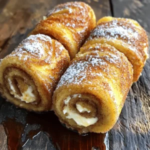 To make Cinnamon Roll French Toast Roll-Ups, you need simple ingredients. Here’s what you will need: - 6 slices of white bread (crusts removed) - 1/4 cup sugar - 2 teaspoons ground cinnamon - 1/4 cup cream cheese, softened - 2 tablespoons butter, melted - 2 large eggs - 1/2 cup milk - 1 teaspoon vanilla extract - Maple syrup (for serving) - Powdered sugar (for dusting) These ingredients come together to create a sweet and creamy treat. The white bread rolls make a perfect base. The cream cheese adds a rich and smooth filling. You’ll mix sugar and cinnamon to give that classic cinnamon roll flavor. Using fresh eggs and milk helps the roll-ups stay fluffy. When you combine the melted butter and vanilla, it adds a nice depth of flavor. Maple syrup and powdered sugar provide the finishing touches. Drizzling syrup and dusting sugar makes each bite even more special. For the full recipe, check out the detailed instructions that guide you through every step. Making Cinnamon Roll French Toast Roll-Ups is fun and simple. Follow these easy steps to create a tasty treat. - Prepare the Cinnamon Sugar: First, mix the sugar and cinnamon in a small bowl. This blend gives a sweet and spicy flavor. Set it aside for later. - Flatten the Bread: Take each slice of white bread and remove the crusts. Use a rolling pin to flatten each slice to about 1/4 inch thick. This makes it easy to roll up. - Spread the Cream Cheese: Take your softened cream cheese. Use a spoon to spread it evenly on one side of each flattened slice. Make sure to cover the whole surface for the best taste. - Roll Them Up: Start at one edge of the bread slice. Roll it tightly, sealing the cream cheese inside. This creates a nice little package of flavor. - Prepare the Egg Mixture: In a bowl, whisk together the eggs, milk, melted butter, and vanilla extract. Mix until it is smooth and well combined. This mixture will coat your roll-ups. - Coat the Roll-Ups: Dip each roll-up into the egg mixture. Make sure each one is fully coated. Then, roll it in the cinnamon sugar mix until it is covered in sweetness. - Cook the Roll-Ups: Heat a non-stick skillet over medium heat. Add a little butter to the skillet. Place the roll-ups seam side down. Cook them for about 2-3 minutes on each side until they are golden brown. - Serve Warm: When cooked, take them out of the skillet. Dust with powdered sugar and drizzle with maple syrup before serving. Enjoy your delicious treat! For the complete recipe, refer to the Full Recipe above. - Use Fresh Ingredients: Fresh bread and cream cheese make a big difference. - Ensure Even Rolling: Roll each slice tightly to keep the filling in. - Adjust Cooking Time: Cook until golden brown, not too long to avoid dryness. - Overfilling the Roll-Ups: Too much filling can cause spills while cooking. - Cooking at Too High a Heat: This can burn the outside before the inside cooks. - Skipping the Dusting: Powdered sugar adds sweetness and a pretty finish. By keeping these tips in mind, you can create delicious Cinnamon Roll French Toast Roll-Ups every time. Each step matters, and avoiding common mistakes will ensure your roll-ups are a hit. Enjoy your cooking adventure with these tasty treats! For a detailed guide, check the Full Recipe. {{image_2}} You can switch up the bread. Try whole wheat or gluten-free bread for a healthier option. Both work great and taste amazing. For cream fillings, use flavored cream cheese or Nutella. These add a fun twist. If you want a unique syrup, use honey or agave instead of maple syrup. Each choice brings a new flavor to your roll-ups. Add spices for more taste. Nutmeg or cardamom can enhance your roll-ups. They bring warmth and depth to the dish. You can also incorporate fruit. Sliced bananas or fresh berries add sweetness and color. If you love chocolate, mix in chocolate chips. They melt perfectly inside the roll-ups, making every bite delightful. Experimenting with these variations makes the Cinnamon Roll French Toast Roll-Ups even more fun. You can create something new each time. For the full recipe, refer to the complete guide on making these tasty treats. To keep your Cinnamon Roll French Toast Roll-Ups fresh, store them properly. - Refrigeration Guidelines: Place any leftover roll-ups in an airtight container. They will stay good in the fridge for up to three days. Make sure they cool down before sealing the container. If you don’t have an airtight container, wrap them tightly in plastic wrap. - Freezing Guidelines: For longer storage, you can freeze the roll-ups. Wrap each roll-up in plastic wrap and then place them in a freezer-safe bag. They will stay fresh for up to two months. When ready to eat, thaw them in the fridge overnight. Reheating is easy and helps keep the flavor intact. - Best Methods for Reheating: The best way to reheat roll-ups is in a skillet over medium heat. This keeps them crispy outside. You can also use an oven set to 350°F. Place them on a baking sheet for about 10 minutes. - Avoid Sogginess: To avoid sogginess, do not microwave them. Microwaving can make them mushy. Always use a dry heat method for the best results. Enjoy your warm, delicious roll-ups! To make these roll-ups, start by gathering your ingredients. You need white bread, sugar, ground cinnamon, cream cheese, butter, eggs, milk, vanilla extract, and toppings like maple syrup and powdered sugar. 1. Mix sugar and cinnamon in a small bowl. 2. Flatten each slice of bread with a rolling pin. 3. Spread cream cheese on one side of each slice. 4. Roll up the bread tightly, encasing the cream cheese. 5. Whisk eggs, milk, melted butter, and vanilla in a bowl. 6. Dip each roll into the egg mixture, then coat with cinnamon sugar. 7. Cook in a skillet with butter until golden brown. 8. Dust with powdered sugar and serve with maple syrup. You can find the full recipe for more details. Yes, you can prepare the roll-ups ahead of time. After rolling them up, place them on a plate and cover with plastic wrap. You can store them in the fridge for a few hours or overnight. When ready to cook, dip them in the egg mixture and proceed as usual. This makes breakfast easy and fun. These roll-ups taste great with various toppings. You can serve them with: - Fresh fruit like strawberries or blueberries. - A drizzle of chocolate sauce for a sweet twist. - A dollop of whipped cream for extra richness. - Nuts for added crunch. You can also serve them alongside bacon or sausage for a complete meal. Absolutely! To make this recipe dairy-free, you can use dairy-free cream cheese. You can also swap regular milk with almond milk, soy milk, or oat milk. Just ensure that your butter is dairy-free as well. If you want to replace cream cheese, here are some great options: - Mascarpone cheese for a rich flavor. - Ricotta cheese for a lighter texture. - Nut butter for a unique twist. - Vegan cream cheese for a dairy-free option. These alternatives will still keep your roll-ups delicious! Cinnamon Roll French Toast Roll-Ups are both fun and easy to make. You learned the key ingredients, step-by-step instructions, and smart tips to avoid mistakes. With a few simple changes, you can customize flavors and use different fillings. Don’t forget how to store leftovers for later enjoyment. Get creative and try new twists on this classic dish. Enjoy your cooking adventure and share these delightful roll-ups with friends and family!