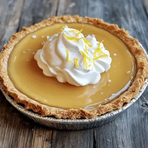 Salted Honey Pie is simple yet delicious. Here’s what you need for this treat: - 1 pre-made graham cracker pie crust - 1 cup honey (preferably wildflower or clover) - 2 tablespoons unsalted butter, melted - 1 cup heavy cream - 3 large eggs - 1 teaspoon vanilla extract - 1/4 teaspoon sea salt (plus more for garnish) - 1 tablespoon fresh lemon juice - Optional garnish: whipped cream and lemon zest Each ingredient plays a key role in the pie. The graham cracker crust gives it a sweet crunch. Honey brings natural sweetness and depth. Using wildflower or clover honey adds unique flavors. Butter adds richness, while heavy cream makes the filling smooth. Eggs bind everything together and help it set. Vanilla enhances the taste, and sea salt balances the sweetness. Lemon juice adds a hint of brightness. You can top it off with whipped cream and lemon zest for a fun finish. For the full recipe, refer to the section above. Enjoy making this easy pie! First, set your oven to 350°F (175°C). This step is key to getting the best bake for your pie. A hot oven helps the filling set well. Grab a mixing bowl. In it, whisk together the honey and melted butter. Make sure they mix well. Next, add the heavy cream, eggs, vanilla extract, sea salt, and lemon juice. Whisk until the mixture is smooth and slightly frothy. This mix brings all the flavors together beautifully. Pour the honey mixture into your pre-made graham cracker pie crust. Make sure to spread it evenly. Place the pie in your preheated oven. Bake for about 30-35 minutes. You want the edges to set while the center stays a bit jiggly. After baking, take the pie out of the oven. Let it cool to room temperature first. Then, transfer it to the refrigerator for at least 2 hours. This cooling time helps the pie set properly. When ready to serve, feel free to garnish with whipped cream, a sprinkle of sea salt, and lemon zest for that extra flavor boost. Enjoy your delicious creation! To make the best salted honey pie, focus on the filling. Whisk the eggs and honey well. This makes the pie smooth and creamy. When mixing, don’t overbeat. A few bubbles are fine; they help the pie rise. Bake until the edges set but the center jiggles slightly. This gives you a soft, custardy texture. You can boost the flavor of your salted honey pie. Use wildflower honey for a rich taste. A splash of lemon juice adds brightness. You can also try different spices. A pinch of cinnamon or nutmeg can add warmth. For an extra touch, top with whipped cream, sea salt, and lemon zest. This makes each bite pop with flavor. Some mistakes can ruin your pie. First, don’t skip the cooling time. It needs to chill for at least 2 hours. This helps it set properly. Second, avoid overbaking. If the pie is too firm, it loses its creamy texture. Lastly, always use a pre-made graham cracker crust. It saves time and gives a great base. For more detailed instructions, check out the Full Recipe. {{image_2}} You can change things up with the crust. If you want a different taste or texture, try using a shortbread crust. It adds a buttery flavor. You can also use an Oreo crust for a chocolate twist. Just crush the cookies and mix them with melted butter. Then, press the mixture into a pie pan. This gives a fun flavor that everyone will love. Want to make your pie unique? You can add different flavors. Try using flavored honey, like lavender or orange blossom, for a new twist. You could also add spices like cinnamon or nutmeg. A splash of almond extract can bring a nice touch too. If you want a fruity taste, mix in some mashed berries or a bit of citrus zest. These flavors will dance on your taste buds. How you serve your pie can make it special. Top it off with whipped cream for a classic look. Add fresh fruit on top for color and flavor. Slices of lemon or berries can brighten up the dish. For a fancy touch, drizzle extra honey over the pie before serving. You can even sprinkle some sea salt on top. These ideas will make your salted honey pie look as good as it tastes. To keep your salted honey pie fresh, store it in the fridge. Cover it with plastic wrap or place it in an airtight container. This helps prevent it from drying out. The pie needs to chill for at least two hours after baking. This time allows the filling to set properly. You can freeze the salted honey pie if you want to store it longer. First, let the pie cool completely. Wrap it tightly in plastic wrap and then in aluminum foil. This double-wrap keeps it safe from freezer burn. You can freeze it for up to three months. When you’re ready to eat it, let it thaw in the fridge overnight. Salted honey pie lasts about four to five days in the fridge. After that, it may lose its texture and flavor. If you freeze it, it can stay good for up to three months. Always check for any changes in smell or texture before you eat it. Enjoy your pie while it’s fresh! Salted honey pie is a sweet dessert made with honey, cream, and eggs. It has a smooth and creamy filling that sits in a crunchy graham cracker crust. The pie has a balance of sweet and salty flavors. The addition of sea salt enhances the honey's taste. Each bite offers a delightful mix of textures and flavors. Yes, you can use different types of honey. Each type brings its unique flavor. Wildflower honey is floral and bright, while clover honey is mild and sweet. You can even try darker honeys like buckwheat for a richer taste. Just remember that the flavor of the honey will change the pie's overall taste. You will know the pie is done when the edges are set. The center should be slightly jiggly but not liquid. It will firm up as it cools. Bake the pie for about 30 to 35 minutes at 350°F (175°C) for the best results. Check it often to avoid overcooking. - Full Recipe for Salted Honey Pie This blog post covered how to make a delicious Salted Honey Pie. We looked at key ingredients, step-by-step instructions, and tips for perfect texture and flavor. I shared common mistakes to avoid and creative variations for your pie. Finally, I highlighted storage tips to keep your pie fresh. Salted Honey Pie is simple yet impressive. Try it at your next gathering and enjoy!