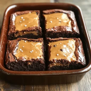 To make Healthy Peanut Butter Stuffed Brownies, gather these key items: - 1 cup almond flour - 1/2 cup cocoa powder - 1/2 cup maple syrup - 1/3 cup unsweetened applesauce - 1/4 cup coconut oil, melted - 3/4 teaspoon baking soda - 1/2 teaspoon sea salt - 1/2 cup natural peanut butter (smooth) - 1/4 cup dark chocolate chips (optional) - 1/2 teaspoon vanilla extract These ingredients help create a rich, moist brownie that satisfies your sweet tooth. You may need to adjust these ingredients based on your diet or allergies. Here are some ideas: - For gluten-free options, use oat flour instead of almond flour. - If you want a vegan treat, replace the eggs with a flaxseed mixture. - For nut-free variations, use sunflower seed butter instead of peanut butter. These substitutes keep the brownies tasty while meeting dietary needs. Let's break down the nutrition of these brownies: - Caloric breakdown: Each brownie offers about 150 calories. - Key vitamins and minerals: Almond flour provides vitamin E, magnesium, and calcium. Cocoa powder adds iron and antioxidants. - Health benefits of ingredients: Almond flour is low in carbs and high in healthy fats. Natural sweeteners like maple syrup are better than refined sugars. These brownies not only taste great but also offer some health benefits. You can enjoy them guilt-free! For the full recipe, check [Full Recipe]. First, preheat your oven to 350°F (175°C). Grease an 8x8 inch baking dish or line it with parchment paper for easy removal. This step helps the brownies not stick to the pan. Next, grab a large mixing bowl. In this bowl, combine the almond flour, cocoa powder, baking soda, and sea salt. Whisk these dry ingredients together until they blend well. This mix is the foundation of your brownies. Now, let’s move to the wet ingredients. In another bowl, mix the maple syrup, unsweetened applesauce, melted coconut oil, and vanilla extract. Stir these until smooth. It is key to mix just enough. You want everything to combine without overmixing. Overmixing can make your brownies tough, not soft. Time to layer the brownies. Pour half of the brownie batter into the prepared baking dish. Spread it evenly to create a solid base layer. Next, using a spoon, dollop the natural peanut butter over this layer. Then, gently spread it out. It’s okay if some brownie batter mixes in with the peanut butter. After that, pour the rest of the brownie batter over the peanut butter layer. Smooth it out with a spatula. If you want, sprinkle dark chocolate chips on top for extra flavor. Now, it’s baking time! Place the dish in the preheated oven. Bake for 20-25 minutes. To check if they are done, insert a toothpick. It should come out clean with a few moist crumbs. Once baked, let the brownies cool in the pan for at least 10 minutes. After cooling, slice them into squares. Enjoy these healthy peanut butter stuffed brownies! For the complete recipe, refer to the Full Recipe section. To get the best texture for your brownies, follow a few simple tips. Use almond flour for a moist and chewy base. Make sure to mix your dry ingredients well. If you don't mix enough, the batter may not rise. The key is to combine just until there are no dry spots. Avoid overmixing the batter. This can make your brownies tough. Stir gently and stop as soon as everything is blended. Also, keep an eye on your baking time. Every oven is different. Start checking your brownies at 20 minutes. A toothpick should come out clean, with a few moist crumbs—perfect! You can boost the flavor of your brownies with a few easy tweaks. Try adding a pinch of cinnamon or a splash of vanilla extract for warmth. These flavors mix well with chocolate. You can also add a hint of espresso powder to deepen the chocolate taste. For toppings, consider adding dark chocolate chips on top. They melt and create a delicious layer. You can also sprinkle nuts or sea salt for added texture. These options make your brownies even more delightful. Brownies are great on their own, but you can make them even better. Serve your healthy peanut butter stuffed brownies warm. Add a scoop of Greek yogurt for creaminess. This pairs well with the rich chocolate flavor. You can also drizzle some chocolate sauce over the top. It adds a sweet touch that everyone loves. For a fun twist, try serving brownies with fresh fruit like berries. The freshness balances the richness of the brownies. Enjoy these ideas to make your treat even more special! {{image_2}} You can make your brownies even better by adding nuts or fruits. Chopped walnuts, pecans, or almonds bring a nice crunch. Dried cherries or bananas give a sweet twist. You can also try mixing in some fresh berries for a fruity burst. Experimenting with chocolate types can change the flavor too. Use dark chocolate for a rich taste. Milk chocolate can make them sweeter. You might like white chocolate for a creamy finish. Each choice gives a new and tasty layer to your brownies. If you're following a keto diet, you can easily adjust this recipe. Swap out maple syrup for a keto-friendly sweetener like erythritol. You can also use unsweetened cocoa powder, which is low in carbs. With these changes, you still keep the flavor while lowering the carbs. For a low-sugar version, use ripe bananas instead of sweeteners. They add natural sweetness and moisture. Applesauce works well too. These options help keep your brownies tasty without extra sugar. Incorporating seasonal ingredients makes your brownies special. In fall, add pumpkin puree and spices like cinnamon. In spring, use fresh strawberries or rhubarb for a bright flavor. These ingredients keep your treats fresh and fun all year. You can also create themed brownies for holidays. For Halloween, add orange food coloring and spooky sprinkles. For Christmas, mix in peppermint extract and crushed candy canes. These themes make your treats festive and exciting for any occasion. For the full recipe, check out the Healthy Peanut Butter Stuffed Brownies. To keep your Healthy Peanut Butter Stuffed Brownies fresh, store them in an airtight container. This will help prevent them from drying out. I recommend using a glass or plastic container with a tight seal. Place parchment paper between layers to avoid sticking. If you have leftovers, freezing them is easy. First, let the brownies cool completely. Then, cut them into squares. Wrap each piece in plastic wrap, and place them in a freezer bag. Squeeze out as much air as possible before sealing. To thaw, leave them in the fridge overnight or at room temperature for a few hours. This method keeps them soft and tasty. These brownies last about a week at room temperature. If you store them in the fridge, they can stay fresh for up to two weeks. Watch for signs of spoilage, like an off smell or mold. If you notice any, it’s best to throw them away. Enjoy your delicious treat while they are fresh! For the full recipe, check out the earlier section. Yes, you can make these brownies vegan! To replace the egg, use a flaxseed meal mixture. Mix one tablespoon of flaxseed meal with three tablespoons of water. Let it sit for five minutes until it thickens. For dairy, use plant-based milk or a non-dairy yogurt instead of applesauce. This swap keeps the texture moist and delicious without any animal products. To check if your brownies are done, use a toothpick. Insert it into the center and pull it out. If it comes out clean or with a few moist crumbs, your brownies are ready. If it’s wet with batter, they need more time. Bake them for an additional two to five minutes and test again. If you want to switch up the peanut butter, you have many options. Almond butter, cashew butter, or sunflower seed butter work well. Each option adds a unique flavor. Choose one that fits your taste or dietary needs. In this article, we explored key ingredients for delicious brownies, including almond flour and cocoa powder. We discussed substitutes for various diets and shared nutritional insights about your favorite treats. You learned step-by-step instructions for making perfect brownies, along with tips for consistency and flavor. We even covered storage tips and creative variations. Remember, making brownies can be simple and fun. Experiment with flavors and adapt recipes to suit your needs. Enjoy your baking journey and savor every bite!