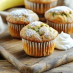 To make these tasty muffins, you'll need: - 1 cup ripe bananas, mashed (about 2-3 medium bananas) - 1 cup grated zucchini (squeeze out excess moisture) - 1/2 cup Greek yogurt (or applesauce for vegan) - 1/3 cup honey or maple syrup - 1/4 cup vegetable oil (or melted coconut oil) - 2 large eggs (or flax eggs for vegan) - 1 teaspoon vanilla extract - 1 1/2 cups whole wheat flour (or gluten-free flour) - 1 teaspoon baking powder - 1/2 teaspoon baking soda - 1/2 teaspoon cinnamon - 1/4 teaspoon salt - Optional: 1/2 cup chopped walnuts or pecans, and/or 1/2 cup chocolate chips You can change some ingredients to suit diets or preferences. Instead of Greek yogurt, use applesauce for a vegan treat. For eggs, flax eggs work great. You can swap vegetable oil for melted coconut oil. If you want gluten-free muffins, just use gluten-free flour. Maple syrup can replace honey if needed, too. Each muffin has about 120 calories. It's packed with nutrients, thanks to bananas and zucchini. You get around 3 grams of protein and 2 grams of fiber. These muffins are a good source of vitamins and minerals. They’re a smart and tasty choice for a snack or breakfast. Enjoy these muffins without guilt, knowing they are both healthy and yummy! Start by gathering your ingredients. You need ripe bananas, grated zucchini, and Greek yogurt. Make sure to squeeze out excess moisture from the zucchini. Preheat your oven to 350°F (175°C). Line a muffin tin with paper liners or grease it. In a big bowl, mix the mashed bananas, zucchini, yogurt, honey, oil, eggs, and vanilla. Stir until well blended. In another bowl, whisk the whole wheat flour, baking powder, baking soda, cinnamon, and salt. Slowly add the dry mix to the wet mix. Fold gently until just combined. If you want, add nuts or chocolate chips. For the best muffins, don’t overmix the batter. A few lumps are fine. Fill each muffin cup about two-thirds full. This helps them rise nicely. Bake for 18-20 minutes. To check if they are done, stick a toothpick in the center. It should come out clean. Keep an eye on the muffins towards the end of baking. Ovens vary, and yours may bake faster or slower. Once baked, let the muffins cool in the pan for about five minutes. Then, transfer them to a wire rack. This helps them cool evenly. Serve them warm for the best taste. You can dust them with powdered sugar or add Greek yogurt on top. Enjoy these muffins for breakfast or as a snack. For the full recipe, check the earlier section. To keep your muffins soft, use ripe bananas. Their natural sugars add sweetness and moisture. Grate the zucchini finely and squeeze out excess water. This step helps avoid sogginess. Adding Greek yogurt or applesauce also helps. They bring moisture without making the muffins heavy. For best results, don't overmix the batter. A few lumps are okay. This keeps the muffins light and fluffy. One common mistake is overbaking. Check your muffins a few minutes early. Insert a toothpick; it should come out clean but not dry. Another mistake is not measuring flour correctly. Use the spoon-and-level method. Scoop flour into your measuring cup and level it off. This method prevents dense muffins. Finally, remember to preheat your oven. This ensures even baking and great rise. Let muffins cool completely before storing. Place them in an airtight container. This keeps them fresh for up to three days. If you want to store them longer, freeze them. Wrap each muffin in plastic wrap and place in a freezer bag. They’ll stay good for up to three months. To enjoy later, thaw at room temperature or microwave for a few seconds. {{image_2}} You can change the taste of your banana zucchini muffins by adding spices. Besides cinnamon, you can use nutmeg, ginger, or allspice. A dash of cardamom adds a nice twist too. Start with 1/4 teaspoon and adjust to your liking. These spices boost flavor without extra calories. They make your muffins warm and cozy, perfect for any time of year. Mix-ins allow you to personalize your muffins. You can add nuts, seeds, or dried fruits. Try walnuts, pecans, or even sunflower seeds for crunch. Dried cranberries or raisins add a sweet touch. For a fun twist, add chocolate chips. You can mix and match to find your perfect combo. Just remember to keep the total amount around 1 cup to ensure the batter remains balanced. If you need gluten-free muffins, swap the whole wheat flour for a gluten-free blend. Many blends work well without changing the taste. For a vegan option, replace eggs with flax eggs. To make a flax egg, mix 1 tablespoon of ground flaxseed with 2.5 tablespoons of water. Let it sit for a few minutes to thicken. You can also substitute Greek yogurt with applesauce for added moisture. These options keep your muffins tasty while meeting your dietary needs. For the complete recipe, check out the Full Recipe section. To keep your banana zucchini muffins fresh, store them in an airtight container. This helps keep moisture in and prevents them from drying out. You can store them at room temperature for up to three days. If you want to save them longer, refrigerate them for up to a week. Always let them cool completely before sealing them up. This step keeps the muffins fluffy and delicious. Freezing is a great option for longer storage. First, let the muffins cool completely. Then, wrap each muffin in plastic wrap. After that, place them in a freezer-safe bag or container. You can freeze them for up to three months. When you’re ready to enjoy them, just take out what you need. Let them thaw at room temperature or pop them in the microwave for a quick warm-up. To reheat your muffins, you have a few options. You can use a microwave for quick heating. Place a muffin on a microwave-safe plate and heat for about 15 to 20 seconds. If you prefer a crispier texture, use an oven. Preheat your oven to 350°F (175°C) and heat the muffins for about 10 minutes. This method brings back the fresh-baked taste. For more details on making these muffins, check the Full Recipe. Yes, you can use frozen bananas or zucchini. Just remember to thaw them first. Drain any extra water from the zucchini. This helps keep your muffins from getting too soggy. To make these muffins healthier, you can: - Use whole wheat flour for more fiber. - Swap honey for a natural sweetener like maple syrup. - Replace vegetable oil with applesauce to cut fat. - Add nuts or seeds for extra nutrients. These changes will boost the health factor while still keeping them tasty. You can use flax eggs as a great egg substitute. To make one flax egg, mix 1 tablespoon of ground flaxseed with 2.5 tablespoons of water. Let it sit for about 5 minutes until it thickens. This works well in the recipe, keeping the muffins moist and fluffy. For a vegan option, you can also use 1/2 cup of unsweetened applesauce. These substitutes work well and are easy to find. This blog post covered all you need for making great muffins. We talked about essential ingredients, helpful tips, and baking steps. You learned substitutions and ways to add flavors. I also shared how to store and reheat them properly. Remember, baking should be fun, so don’t stress if things go wrong. With the right info and a little practice, you will bake tasty muffins every time. Enjoy your baking journey!