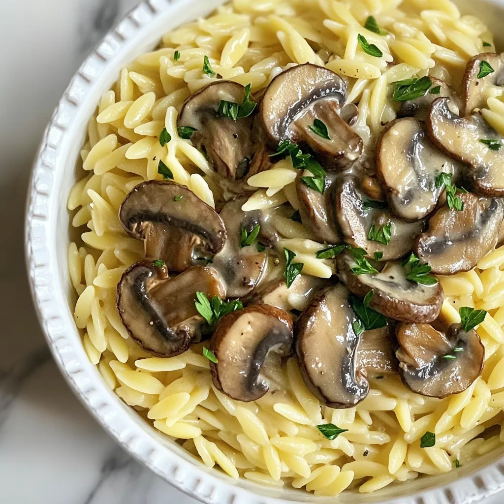 - 1 cup orzo pasta - 2 cups vegetable broth - 1 cup mushrooms (cremini or button), sliced - 1 small onion, finely chopped - 2 cloves garlic, minced - 1 teaspoon dried thyme - ½ teaspoon black pepper - Salt to taste - ½ cup heavy cream (or coconut cream for a dairy-free version) - ¼ cup grated Parmesan cheese (omit for a vegan version) - Fresh parsley, chopped (for garnish) I love the simplicity of this dish. The main ingredient, orzo pasta, makes it special. Orzo is small, rice-shaped pasta that cooks quickly. The vegetable broth brings a rich flavor to the pasta. I recommend using fresh mushrooms, either cremini or button. They add a great texture and taste. For aromatics, I always use fresh onion and garlic. They create a wonderful base for the dish. Dried thyme gives a lovely earthy note. Black pepper and salt help enhance all the flavors. The creamy elements are what make this dish truly dreamy. Heavy cream adds richness, but coconut cream works well for a dairy-free option. Don’t forget the Parmesan cheese! It melts perfectly and adds depth. Finally, fresh parsley brightens the plate and gives a burst of color. In just a few steps, you will create a comforting and satisfying meal. {{ingredient_image_1}} 1. Boil the Vegetable Broth: In a medium saucepan, bring 2 cups of vegetable broth to a boil. 2. Cook the Orzo: Add 1 cup of orzo pasta to the broth. Cook it for 8 to 10 minutes. The orzo should be al dente. 3. Drain and Set Aside: Once cooked, drain the orzo and set it aside for later. 1. Sauté the Onion: In a large skillet, heat 1 tablespoon of olive oil over medium heat. Add 1 small, finely chopped onion. Sauté it until it turns translucent, about 3 to 4 minutes. 2. Add Garlic and Mushrooms: Next, stir in 2 minced garlic cloves and 1 cup of sliced mushrooms. Cook this mixture for 5 to 7 minutes until the mushrooms become tender and brown. 1. Season the Mixture: Add 1 teaspoon of dried thyme, ½ teaspoon of black pepper, and salt to taste. Stir well to combine. 2. Incorporate Heavy Cream: Lower the heat and pour in ½ cup of heavy cream. Mix thoroughly until the cream heats through. 3. Combine with Orzo: Add the cooked orzo to the skillet with the creamy mushroom sauce. Stir until the orzo is well coated. If it's too thick, add a splash of vegetable broth to reach your desired creaminess. This process makes a rich, creamy dish that feels warm and comforting. Enjoy the blend of flavors as they come together! To cook orzo al dente, start with boiling vegetable broth. After it boils, add the orzo. Cook it for 8-10 minutes. Check the package for exact times. You want the orzo firm but not hard. Drain it well and set it aside. For creaminess, add vegetable broth to your sauce. If your dish feels too thick, just pour in a splash. This will help reach your desired texture. Fresh herbs add great taste. Try adding chopped parsley or thyme. They brighten up the dish. You can also use a pinch of red pepper flakes for heat. This little kick can make it pop. To complement the flavors, think about adding a squeeze of lemon juice. It balances the cream and mushrooms beautifully. Serve the creamy orzo in shallow bowls. This makes it look inviting. Top with extra grated Parmesan for richness. A sprinkle of fresh parsley adds color and freshness. It makes the dish more vibrant and appealing. Pro Tips Use Fresh Herbs: Fresh thyme can elevate the flavor of your dish significantly. If available, opt for fresh herbs over dried for a more vibrant taste. Cooking Orzo: Make sure to stir the orzo occasionally while cooking to prevent it from sticking together. This ensures a nice, fluffy texture. Adjust Creaminess: If you prefer a lighter dish, you can substitute part of the heavy cream with vegetable broth or a splash of white wine for added depth without the heaviness. Perfect Mushroom Sauté: Allow the mushrooms to brown properly in the skillet without overcrowding them. This will enhance their flavor and texture, making them more delicious. {{image_2}} You can make a vegan version of creamy mushroom orzo. For this, swap heavy cream for coconut cream. This change keeps the dish rich and creamy without dairy. Omit the Parmesan cheese to maintain the vegan aspect. This will still provide a satisfying taste and texture, allowing everyone to enjoy it. Want to boost the protein? Try adding grilled chicken or sautéed shrimp. Cook the protein separately and mix it in at the end. This addition makes the dish more filling and adds a new layer of flavor. You can also season the protein to match the orzo, enhancing the overall taste. Feel free to get creative with vegetables. You can add spinach or peas for extra color and nutrition. Simply toss them in during the last few minutes of cooking. This will keep the veggies bright and tender. Other veggies like bell peppers or zucchini also work well, making the dish even more vibrant and healthy. To keep your Creamy Mushroom Orzo fresh, store it in an airtight container. Make sure it cools down before sealing. This way, it won’t trap steam and get soggy. It lasts about 3 to 4 days in the fridge. Always check for any changes in smell or color before eating. When reheating creamy orzo, use low heat. This helps keep the texture smooth. You can add a splash of vegetable broth or cream to make it creamy again. Stir often to heat evenly. A microwave works too; just cover it to prevent drying out. You can freeze Creamy Mushroom Orzo! Portion it out in airtight containers. It stays good for about 2 to 3 months. To thaw, place it in the fridge overnight. Reheat on the stove or microwave, adding a little broth if needed. This keeps the dish creamy and tasty. To make Creamy Mushroom Orzo gluten-free, I suggest using gluten-free orzo pasta. This type cooks just like regular orzo. You can also check if your vegetable broth is gluten-free. Some brands may include gluten. Always read the labels carefully. This way, you can enjoy the same creamy flavor without worry. Yes, you can use various mushrooms in this dish. Cremini and button mushrooms are great options. They add a mild, earthy flavor. If you want bolder tastes, try shiitake or portobello mushrooms. These mushrooms have a deeper flavor that brings more depth to the dish. Mixing different types can also create a unique taste and texture. To make more servings of Creamy Mushroom Orzo, simply double or triple the ingredients. For example, use 2 cups of orzo and 4 cups of broth for eight servings. Keep the cooking times similar. You may need a larger pot to hold everything. Just make sure to stir well to combine all the flavors. In this blog post, we explored how to make a delicious Creamy Mushroom Orzo. We covered key ingredients, from orzo and broth to aromatics and creamy elements. I shared step-by-step cooking instructions and helpful tips for perfect texture and flavor. You can adapt this recipe for vegan options and add protein or veggies to suit your taste. Remember to store leftovers properly for later enjoyment. With these easy steps and tips, you will create a dish that delights everyone. Enjoy your cooking adventure!