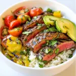 To make these tasty bowls, you need: - 1 lb flank steak - 1 cup jasmine rice - 2 cups chicken broth (or vegetable broth) - 1 cup fresh cilantro, chopped - 2 limes (juiced and zested) - 2 cloves garlic, minced - 1 tablespoon olive oil - 1 teaspoon cumin - 1 teaspoon paprika - 1/2 teaspoon salt - 1/2 teaspoon black pepper - 1 cup cherry tomatoes, halved - 1 avocado, sliced You can add more taste with these: - 1/2 cup corn (fresh or canned) If you have dietary needs, try these swaps: - Use quinoa instead of jasmine rice. - Swap flaxseed oil for olive oil for a vegan option. - Use tofu or tempeh in place of flank steak for a plant-based meal. {{ingredient_image_1}} To start, mix olive oil, lime juice, lime zest, garlic, cumin, paprika, salt, and pepper in a bowl. This mix will give your steak a burst of flavor. Take the flank steak and coat it well with this marinade. Cover the bowl and place it in the fridge. Let it marinate for at least 30 minutes. For even better taste, let it sit for up to 2 hours. While the steak marinates, rinse jasmine rice under cold water. This step removes excess starch and helps the rice stay fluffy. In a medium saucepan, bring chicken broth to a boil. Add the washed rice to the boiling broth. Lower the heat to low and cover it. Cook for about 15-18 minutes until the rice absorbs all the liquid. After cooking, let it sit covered for another 5 minutes. Preheat your grill or stovetop grill pan over medium-high heat. Once hot, take the steak out of the marinade. Grill the steak for about 5-7 minutes on each side. Check for your preferred doneness. After grilling, let it rest for 5 minutes. This resting time helps keep the steak juicy. Slice the steak against the grain for the best texture. Fluff the cooked rice with a fork. Mix in half of the chopped cilantro for a fresh taste. In serving bowls, begin with a layer of the cilantro lime rice. Then, place the grilled steak slices on top. Add halved cherry tomatoes and sliced avocado. If you like, sprinkle some corn on top. Finish by garnishing with the rest of the cilantro and a lime wedge. This adds a nice touch of brightness to your bowls. To get the best flavor, start with a good marinade. Mix olive oil, lime juice, zest, garlic, cumin, paprika, salt, and pepper in a bowl. Coat the flank steak well. Marinate it for at least 30 minutes, but up to 2 hours is even better. The longer it sits, the more flavor it absorbs. Keep it in the fridge to stay fresh. Rinse the jasmine rice under cold water until the water is clear. This step removes excess starch and helps the rice stay fluffy. In a medium saucepan, bring chicken broth to a boil. Add the rice, reduce the heat to low, and cover. Cook for about 15-18 minutes. Once done, let it sit for 5 minutes off the heat. Fluff it with a fork and mix in half of the chopped cilantro for a fresh taste. When serving, layer the ingredients to show off their colors. Start with the cilantro lime rice, then add the grilled steak slices. Top with halved cherry tomatoes and sliced avocado. If you like, add corn for extra sweetness. Garnish with the remaining cilantro and a lime wedge for a fresh pop. Drizzle any leftover marinade over the top for extra flavor. This makes your bowls look and taste amazing! Pro Tips Marination Time: For the best flavor, marinate the steak for at least 2 hours or overnight if possible. Resting the Steak: Allow the grilled steak to rest for 5 minutes before slicing to retain its juices. Rice Rinsing: Rinse the jasmine rice thoroughly to remove excess starch, resulting in fluffier rice. Presentation: Layer the ingredients in the bowl to highlight the vibrant colors and textures for a stunning presentation. {{image_2}} If you want a vegetarian or vegan bowl, skip the steak. Use marinated mushrooms or portobello caps instead. They soak up flavors so well. You can also use grilled zucchini or bell peppers. These veggies add great taste and color. For the base, keep the jasmine rice and mix in more cilantro for that fresh taste. Chicken is a tasty substitute for steak. Use chicken thighs or breasts for a juicy result. Marinate them just like the steak. Grill until cooked through, about 6-8 minutes per side. Tofu is another great option. Press it to remove excess moisture. Then, cube it and marinate. Grill or sauté until crispy on the outside. Both options work well in these bowls. Spice things up by adding chili powder or cayenne for heat. You can also mix in fresh herbs like parsley or mint for a twist. Try adding a dash of smoked paprika for depth. For a citrusy kick, use orange juice along with lime juice. Experimenting with flavors makes each bowl unique and fun. To keep your Cilantro Lime Steak Rice Bowls fresh, let them cool first. Place the leftovers in an airtight container. Store them in the fridge for up to three days. Make sure to separate the rice, steak, and toppings for better storage. This helps keep everything fresh and tasty. For reheating, the microwave works well. Place the rice and steak in a bowl. Cover it with a damp paper towel to keep moisture in. Heat for one to two minutes, checking halfway through. You can also use a skillet on low heat. Add a splash of broth or water to prevent drying out. Heat while stirring until warm. If you want to freeze your rice bowls, store them in freezer-safe containers. Keep the rice and steak separate from toppings like avocado and tomatoes. These toppings do not freeze well. Use the frozen meals within three months for the best taste. When you are ready to eat, thaw in the fridge overnight and reheat as mentioned. Yes, you can prepare the cilantro lime steak rice bowls ahead of time. You can marinate the steak the night before. Just keep it in the fridge. You can also cook the rice and store it in an airtight container. This way, your meal is almost ready when you need it. Just grill the steak and assemble the bowls when you are ready to eat. These bowls taste great with many sides. You can add black beans for extra protein. A fresh green salad adds crunch. You might also serve tortilla chips for some fun texture. Don’t forget to offer hot sauce for those who like a kick! To check if your steak is done, use a meat thermometer. Aim for 130°F for medium-rare and 145°F for medium. If you don’t have a thermometer, you can use the touch test. Press the steak with your finger. If it feels soft, it's rare. If it feels firm, it’s done! To adjust the spice level, you can add more or less paprika and cumin. If you like heat, add some chili powder or cayenne pepper. For a milder taste, reduce these spices. You can also serve a mild salsa on the side for those who want less spice. In this post, we explored how to make Cilantro Lime Steak Rice Bowls. We covered the key ingredients, marinating techniques, and cooking methods. I shared tips for perfect rice and tasty variations for different diets. Remember, meal prep can be easy. Storing leftovers helps save time. Experiment with flavors to find your perfect bowl. Enjoy creating your own delicious version!