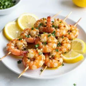 To make Lemon Garlic Shrimp Skewers, you will need: - 1 lb large shrimp, peeled and deveined - 3 tablespoons olive oil - 3 tablespoons fresh lemon juice - 4 cloves garlic, minced - 1 teaspoon smoked paprika - 1 teaspoon dried oregano - Salt and pepper to taste These ingredients bring out the bright flavor of lemon and the warmth of garlic. Each shrimp gets a lovely coat of marinade, making every bite juicy and zesty. For garnishing, you will want: - Fresh parsley, chopped - Lemon wedges, for serving Chopped parsley adds a fresh touch. Lemon wedges give you a chance to add more zing right before eating. To cook these skewers, you will need: - Skewers (wooden or metal) - Grill or grill pan If you use wooden skewers, soak them in water before grilling. This step helps prevent burning. A good grill or grill pan gives you those perfect grill marks and keeps the shrimp juicy. {{ingredient_image_1}} To start, gather your mixing bowl. In it, combine three tablespoons of olive oil and three tablespoons of fresh lemon juice. Add in four minced garlic cloves, one teaspoon of smoked paprika, and one teaspoon of dried oregano. Season with salt and pepper to taste. Whisk these together until they blend well. This marinade gives the shrimp a bright flavor that shines through. Next, add your one pound of peeled and deveined shrimp to the marinade. Toss the shrimp gently until each piece is coated in the mix. Cover the bowl with plastic wrap or a lid. Place it in the fridge for at least thirty minutes. This step lets the flavors soak into the shrimp, making them more tasty. If you're using wooden skewers, soak them in water for ten to fifteen minutes. This helps prevent burning on the grill. While the skewers soak, preheat your grill or grill pan to medium-high heat. Lightly oil the grates if you're using a grill. Now, thread four to five marinated shrimp onto each skewer. Place the skewers on the grill. Cook them for two to three minutes on each side. Keep an eye on the shrimp; they should turn pink and opaque when done. Avoid overcooking, as shrimp can become tough. Once cooked, let the skewers rest for a minute. Garnish with fresh chopped parsley and serve with lemon wedges for extra zest. Enjoy your delicious lemon garlic shrimp skewers! When picking shrimp, size matters. Look for large shrimp, about 16-20 per pound. Fresh shrimp should smell like the ocean, not fishy. Check for a firm texture and a shiny look. If you can, buy shrimp that is wild-caught. It often tastes better and is more sustainable. To grill shrimp well, preheat your grill or pan on medium-high heat. This step ensures that you get a good sear. Lightly oil the grill grates or the skewers to stop sticking. Place the shrimp on the grill and cook for 2-3 minutes on each side. You want them to be pink and opaque. Avoid overcooking; shrimp can turn rubbery. For the best flavor, marinate shrimp for at least 30 minutes. This time allows the shrimp to soak in the lemon and garlic goodness. If you have more time, marinating for up to 2 hours is even better. Just keep it in the fridge to stay fresh. Don&rsquo;t marinate too long, as the acid from the lemon can change the shrimp's texture. Pro Tips Fresh Shrimp: Always opt for the freshest shrimp available. Fresh shrimp not only taste better but also have a firmer texture that holds up well on the grill. Marinade Time: For best flavor, marinate the shrimp for at least 30 minutes, but not more than 2 hours. This ensures they absorb the flavors without becoming mushy. Skewering Technique: To prevent shrimp from spinning on the skewers, thread them through the tail and body. This will help them stay in place while grilling. Grill Temperature: Make sure your grill is preheated properly. Grilling shrimp on too low a heat can lead to uneven cooking and a rubbery texture. {{image_2}} To add some heat, try spicy lemon garlic shrimp skewers. Just mix in some red pepper flakes or diced jalape&ntilde;os to the marinade. This gives a nice kick that pairs well with the lemon and garlic. The spice enhances the shrimp's flavor and makes each bite exciting. You can also make lemon garlic shrimp skewers with vegetables. Bell peppers, zucchini, and cherry tomatoes work well. Simply cut the veggies into chunks and add them to the skewers with the shrimp. They soak up the marinade and add color to your dish. This option makes the meal more filling and adds extra nutrition. If you don't have a grill, you can still enjoy these skewers. You can cook them in the oven or under the broiler. Preheat the oven to 400&deg;F (200&deg;C). Place the skewers on a baking sheet lined with foil. Cook for about 6-8 minutes, flipping halfway through. For the broiler, place the skewers on the top rack and broil for 2-3 minutes on each side. This method gives you that charred flavor without a grill. After enjoying your shrimp skewers, let them cool to room temperature. Place the skewers in an airtight container. This keeps them fresh and tasty. You can store them in the fridge for up to 3 days. If you want to keep them longer, consider freezing. To reheat the shrimp, use your grill or a skillet. Heat the grill to medium. Place the skewers on the grill for about 1-2 minutes per side. This warms them without drying them out. If using a skillet, heat it on medium-low. Cook for 2-3 minutes, turning once. Always check that the shrimp are hot all the way through. To freeze shrimp skewers, wrap each skewer in plastic wrap. Place them in a freezer-safe bag. They can last up to 3 months in the freezer. When ready to eat, remove the skewers and place them in the fridge overnight. Once thawed, reheat them using the methods shared above. Enjoy your shrimp like they were just cooked! Yes, you can use frozen shrimp. Just make sure to thaw them first. Place the shrimp in the fridge overnight or run them under cold water for quick thawing. Once thawed, peel and devein if needed. This will help the shrimp absorb the marinade better. These shrimp skewers pair well with many sides. Here are a few ideas: - Steamed rice - Quinoa salad - Grilled vegetables - Garlic bread - A fresh green salad These options will balance the flavors of the shrimp and make for a complete meal. Marinate the shrimp for at least 30 minutes. This time allows the shrimp to soak in the flavors. If you have more time, marinating for 1-2 hours will enhance the taste even more. Just don&rsquo;t marinate too long, or the shrimp can become tough. You can use wooden or metal skewers. If you choose wooden skewers, soak them in water for 10-15 minutes first. This step prevents burning on the grill. Metal skewers are great too, as they don&rsquo;t require soaking and can be reused. Lemon garlic shrimp skewers offer a tasty meal made with simple steps. You learned about essential ingredients, marinating tips, and grilling techniques. Variations like adding veggies or spice can change the dish. Proper storage ensures you enjoy leftovers later. With all this at hand, you can create a delicious meal. Enjoy cooking and impressing friends and family with your new skills!